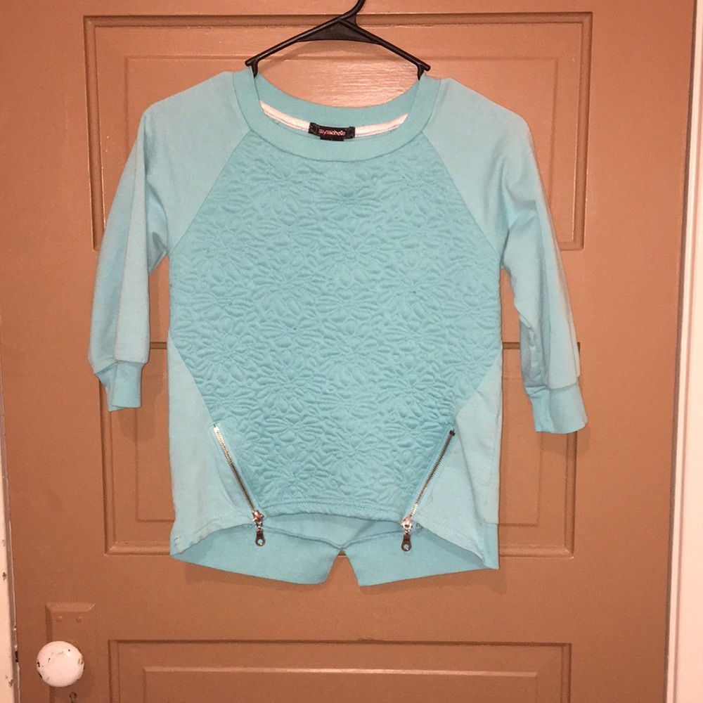 Light blue/ teal long sleeve with zippers.